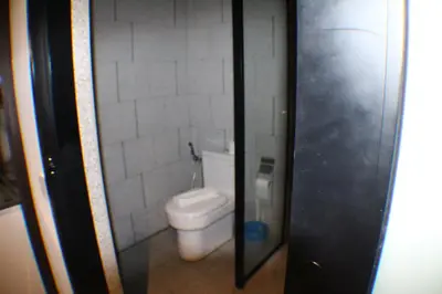 a small bathroom with a toilet in a stall at Hospitality Service Suites Scarlitz KLCC in Kuala Lumpur