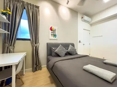 a bedroom with a bed and a desk and a window at 4BR KLCC View MRT 2min Free Parking Big Unit in Kuala Lumpur