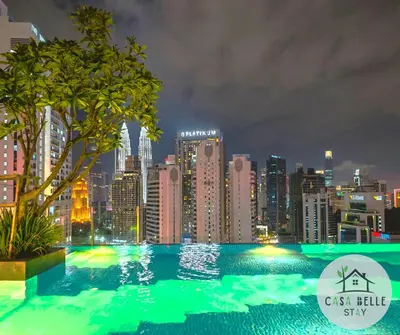 a view of a city skyline at night at The Majestic Residence Suites By Casabellestay in Kuala Lumpur
