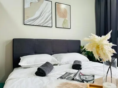 a bed with white sheets and pillows and a table at MVA19#Family Suite 8 pax 3 Rooms Sunway Velocity Mall, MRT Maluri Cheras in Kuala Lumpur