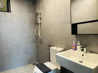 a bathroom with a white toilet and a sink at MVA19#Family Suite 8 pax 3 Rooms Sunway Velocity Mall, MRT Maluri Cheras in Kuala Lumpur
