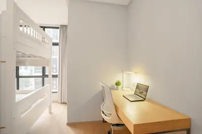 a room with a desk with a laptop on it at 188 Suites by KidsCastle in Kuala Lumpur