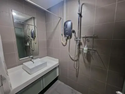 a bathroom with a sink and a shower at Cozy Family Suite 5pax KLCC by SS HOME in Kuala Lumpur