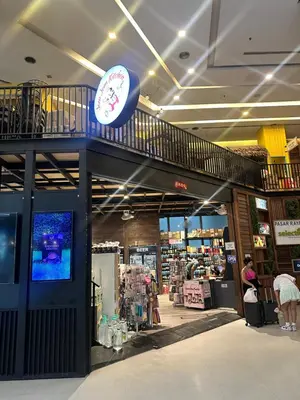 a store with a clock on the top of it at Cozy Family Suite 5pax KLCC by SS HOME in Kuala Lumpur