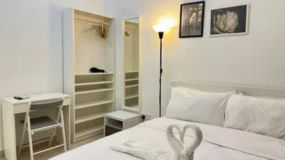 a bedroom with a bed with a heart towel on it at Couple home Netflix free parking A45 08St Trion KL in Kuala Lumpur