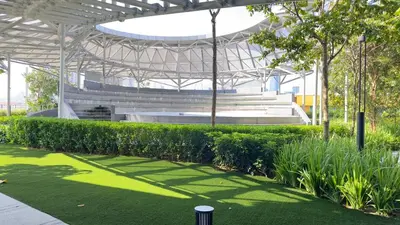 a stadium with a grass field and benches at Couple home Netflix free parking A45 08St Trion KL in Kuala Lumpur