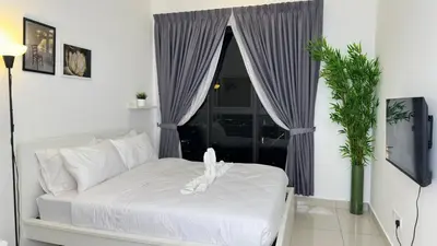 a bedroom with a white bed and a window at Couple home Netflix free parking A45 08St Trion KL in Kuala Lumpur