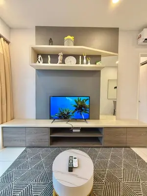a living room with a flat screen tv on a wall at Robertson Homefeel 1R1B at Bukit Bintang KL KLCC in Kuala Lumpur