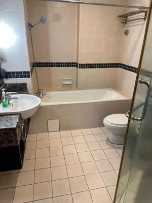 a bathroom with a tub and a toilet and a sink at Seri bukit Ceylon by anhome changkat in Kuala Lumpur