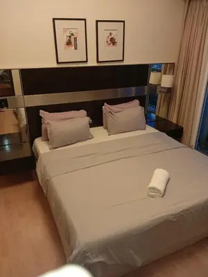 a bedroom with a large bed with a white towel on it at Seri bukit Ceylon by anhome changkat in Kuala Lumpur