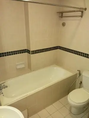 a bathroom with a white tub and a toilet at Seri bukit Ceylon by anhome changkat in Kuala Lumpur