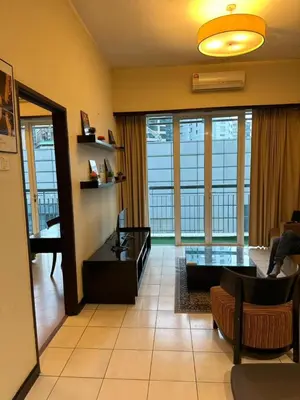 a living room with a couch and a table at Seri bukit Ceylon by anhome changkat in Kuala Lumpur