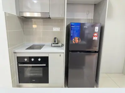a kitchen with a refrigerator and a stove at Couple 1BR cozy suite B41 05 Trion KL in Kuala Lumpur
