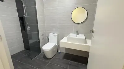 a bathroom with a toilet and a sink and a mirror at Couple 1BR suite B33 03 free parking Netflix Trion KL in Kuala Lumpur