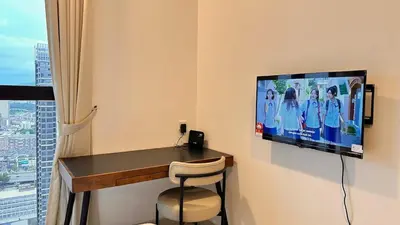 a room with a desk and a tv on the wall at Couple nest A37 10St Trion KL in Kuala Lumpur