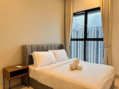a bedroom with a bed with a large window at Couple nest A37 10St Trion KL in Kuala Lumpur