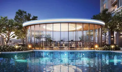 a building with a swimming pool in front of a building at Couple Studio Suite A16 07 Trion KL in Kuala Lumpur