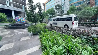 a white van parked in front of a building at Couple Studio Suite A28 07 Trion KL in Kuala Lumpur