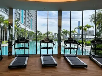 a gym with a swimming pool in a building at Couple Studio Suite A28 07 Trion KL in Kuala Lumpur
