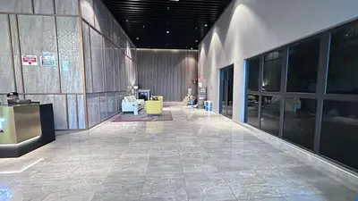 a lobby with a yellow chair in a building at Couple Studio Suite A28 07 Trion KL in Kuala Lumpur