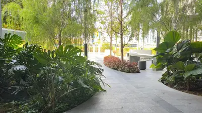 a garden with a bench and a bunch of plants at Couple Studio Suite B29 03A Trion KL in Kuala Lumpur