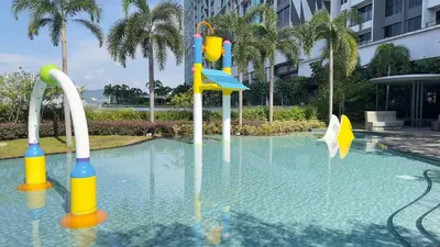 a swimming pool with a playground in the water at Couple Studio Suite B29 03A Trion KL in Kuala Lumpur