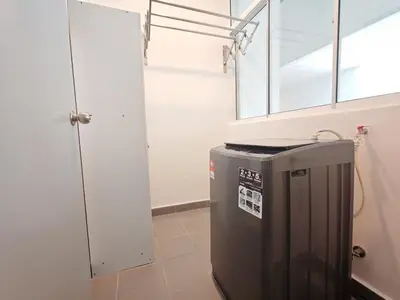 a laundry room with a refrigerator and a window at O 3 Room 200mbps wifi near Mrt Lrt HKL PWTC KLCC in Kuala Lumpur