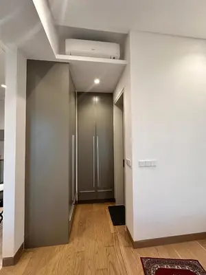 a hallway with a door and a ceiling at Lucentia Residences By CasaLuxe in Kuala Lumpur