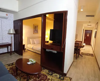 a living room with a couch and a television in a room at Times Apartment at Times Square in Kuala Lumpur