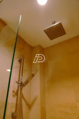 a bathroom with a shower with a sign on the ceiling at KL Hartamas 1BR, Mall Link, Wifi Smart TV in Kuala Lumpur