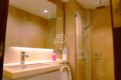a bathroom with a sink and a shower with a mirror at KL Hartamas 1BR, Mall Link, Wifi Smart TV in Kuala Lumpur