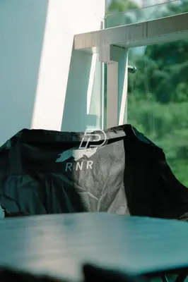 a bag sitting on a table in front of a window at KL Hartamas 1BR, Mall Link, Wifi Smart TV in Kuala Lumpur