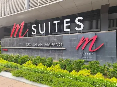a building with a sign for a m suites pharmacy at Condo in Jalan Ampang- near KLCC IJN Gleneagles HKL TRX in Kuala Lumpur