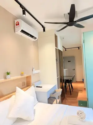 a bedroom with a bed and a ceiling fan at The Sentral Nook KL Sentral By Riveria city in Kuala Lumpur