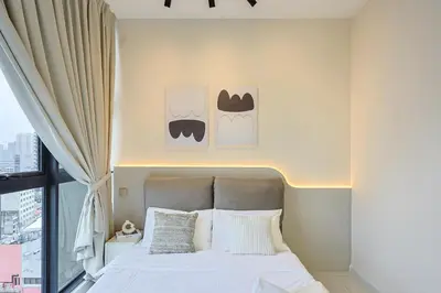 a bedroom with a bed and a window at Majestic Residence Home Plus in Kuala Lumpur