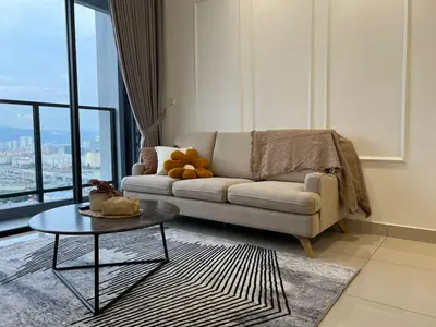 a living room with a couch and a table at Trion KL By AlwaysHome in Kuala Lumpur