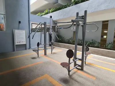 a row of gym equipment in a building at Neu Suites Tiny Queen Bed Studio 10 mins to KLCC in Kuala Lumpur