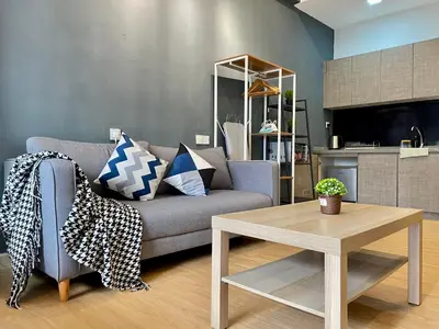 a living room with a couch and a table at Holiday Place Residence Kuala Lumpur in Kuala Lumpur