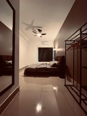 a bedroom with a bed and a ceiling fan at Raay Home at Razak City Residence KL in Kuala Lumpur