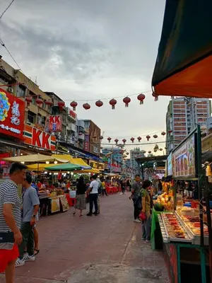 a group of people walking around an outdoor market at Near in Kuala Lumpur