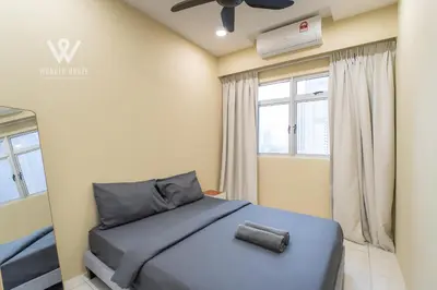 a bedroom with a blue bed and a window at 6 pax Modern 3BR Stay in Sentul near KL City in Kuala Lumpur