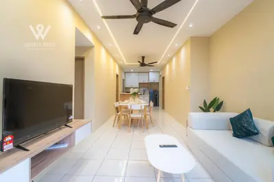 a living room with a white couch and a flat screen tv at 6 pax Modern 3BR Stay in Sentul near KL City in Kuala Lumpur