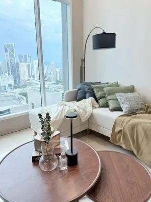 a living room with a couch and a table at Soho Suites KLCC by City Keys in Kuala Lumpur