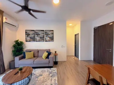 a living room with a couch and a ceiling fan at 2BR with Balcony High Floor, Henna Residence Near LRT Sri Rampai & Wangsa Walk Mall in Kuala Lumpur