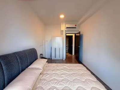 a couch sitting in a room with a wall at 2BR with Balcony High Floor, Henna Residence Near LRT Sri Rampai & Wangsa Walk Mall in Kuala Lumpur