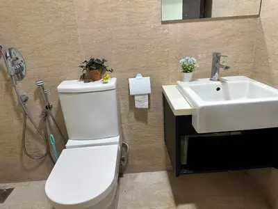 a bathroom with a toilet and a sink at Regalia KLCC Pavilion Ceylon Jalan Alor 8 PAX 2R2B in Kuala Lumpur