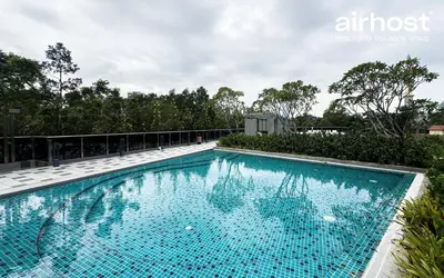 a swimming pool on the roof of a house at MET 1 Residences Mont Kiara by Airhost in Kuala Lumpur