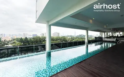 a swimming pool on the roof of a building at MET 1 Residences Mont Kiara by Airhost in Kuala Lumpur