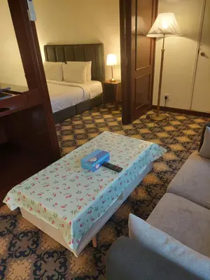 a hotel room with a bed and a table at kl Dreamx service suite at times square in Kuala Lumpur