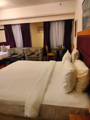 a large white bed in a hotel room at kl Dreamx service suite at times square in Kuala Lumpur